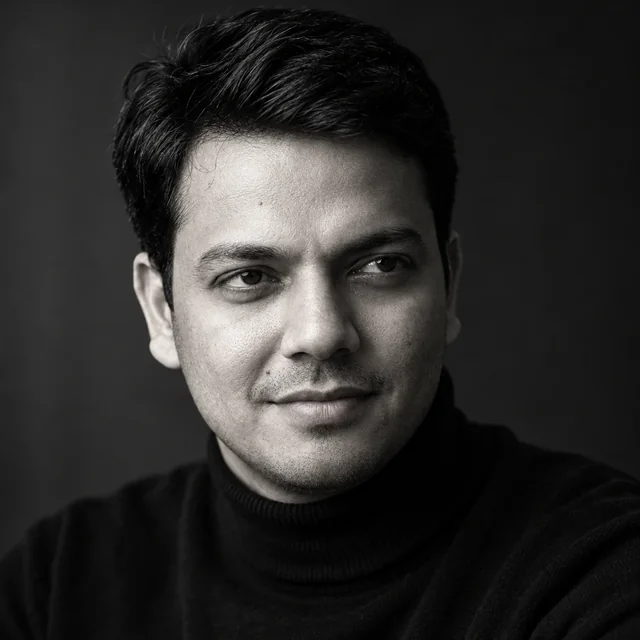 Black-and-white portrait of Dinesh Kumar, Founder and CEO of Quantum AGI
