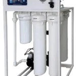 ORG 100 LPH commercial RO plant on a frame with control panel, gauge, filter housings and booster pump